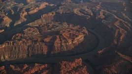 5.5K aerial stock footage of The Loop West, Meander Canyon, and Colorado River at sunset, Canyonlands National Park, Utah Aerial Stock Footage | AX138_317E