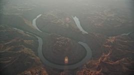 5.5K aerial stock footage circling Colorado River in Meander Canyon at sunset, Canyonlands National Park, Utah Aerial Stock Footage | AX138_333E