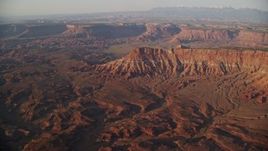 5.5K aerial stock footage of approaching Lockhart Canyon and mesas, Moab, Utah, sunset Aerial Stock Footage | AX138_338E