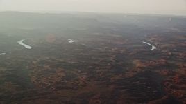 5.5K aerial stock footage of flying by the Colorado River in Meander Canyon, Canyonlands National Park, Utah, sunset Aerial Stock Footage | AX138_340
