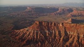 5.5K aerial stock footage of orbiting a butte near Lockhart Canyon, Moab, Utah, sunset Aerial Stock Footage | AX138_341E
