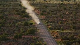 5.5K aerial stock footage video of an SUV on Hatch Point Road, Moab, Utah, sunset Aerial Stock Footage | AX138_358