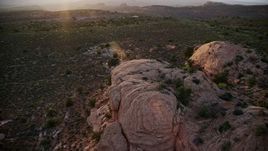 5.5K aerial stock footage orbit and flyover tall rock formations, Moab, Utah, sunset Aerial Stock Footage | AX138_385E