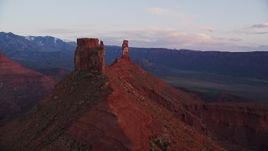 5.5K aerial stock footage of approaching and orbiting Castleton Tower at sunset, Moab, Utah Aerial Stock Footage | AX138_414E