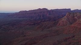 5.5K aerial stock footage of an approach to rock formations and mesa, Fisher Towers, Utah, sunset Aerial Stock Footage | AX138_428E