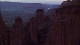 5.5K aerial stock footage fly over rock formations, approach Colorado River and canyon, Fisher Towers, Utah, twilight Aerial Stock Footage | AX138_435E