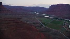 5.5K aerial stock footage of flying over State Route 128, approaching the Colorado River, Moab, Utah, twilight Aerial Stock Footage | AX138_455E