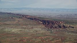 5.5K aerial stock footage of passing by Devil's Garden in Arches National Park, Utah Aerial Stock Footage | AX139_003E