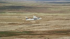 5.5K aerial stock footage of flying beside a Tecnam P2006T and Cessna flying over desert, Grand County, Utah Aerial Stock Footage | AX139_057E