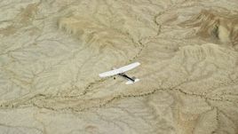 5.5K aerial stock footage of an air to air view of a Cessna flying over desert, Grand County, Utah Aerial Stock Footage | AX139_086