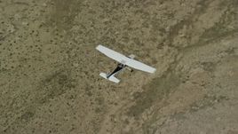 5.5K aerial stock footage of a bird's eye of a Cessna plane in flight high over desert, Carbon County, Utah Aerial Stock Footage | AX139_156E