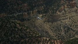 5.5K aerial stock footage track a Cessna airplane over desert mountains, Carbon County, Utah Aerial Stock Footage | AX140_013E