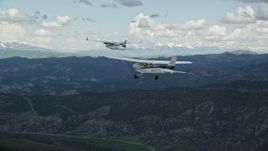 5.5K aerial stock footage track Cessna flying with Tecnam P2006T near mountains and Highway 6, Wasatch Range, Utah Aerial Stock Footage | AX140_054E