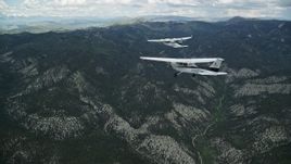 5.5K aerial stock footage of following a Cessna tailing a Tecnam P2006T over the Wasatch Range, Utah Aerial Stock Footage | AX140_071E