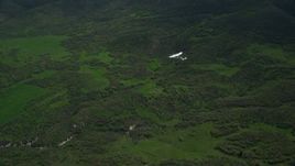 5.5K aerial stock footage of tracking Tecnam P2006T near green mountain ridge in the Wasatch Range in Utah Aerial Stock Footage | AX140_110E