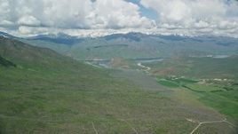 5.5K aerial stock footage of Tecnam P2006T flying near reservoir and green mountains, Deer Creek Reservoir, Utah Aerial Stock Footage | AX140_155E