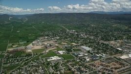 5.5K aerial stock footage of approaching small town, pan across neighborhoods, Heber City, Utah Aerial Stock Footage | AX140_176E