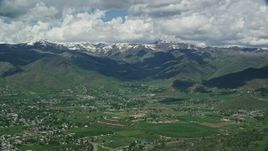5.5K aerial stock footage of a wide view of snowy peaks from small town of Midway, Wasatch Range, Utah Aerial Stock Footage | AX140_178E