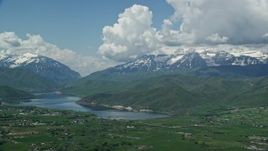5.5K aerial stock footage of snowy Mount Timpanogos and Deer Creek Reservoir, seen from Midway, Utah Aerial Stock Footage | AX140_180E