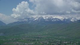 5.5K aerial stock footage of snow-capped Mount Timpanogos seen from town of Midway, Utah Aerial Stock Footage | AX140_183