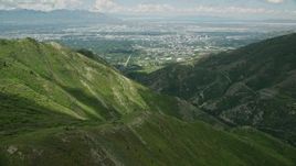 5.5K aerial stock footage fly over Wasatch Range toward University of Utah and Downtown Salt Lake City, Utah Aerial Stock Footage | AX140_241E