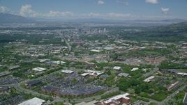 5.5K aerial stock footage of flying over University of Utah to approach Downtown Salt Lake City, Utah Aerial Stock Footage | AX140_246