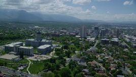 5.5K aerial stock footage of passing the Utah State Capitol with view of Downtown Salt Lake City, Utah Aerial Stock Footage | AX140_256