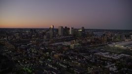 5.5K aerial stock footage flying over heavy traffic, by Downtown Boston skyline, Massachusetts, twilight Aerial Stock Footage | AX141_015E