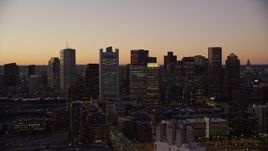 5.5K aerial stock footage flying by buildings, skyscrapers, Downtown Boston skyline, Massachusetts, twilight Aerial Stock Footage | AX141_019E