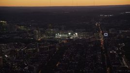 5.5K aerial stock footage flying by Fenway Park under lights, Boston, Massachusetts, twilight Aerial Stock Footage | AX141_029