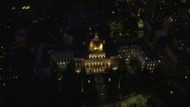 5.5K aerial stock footage approaching Massachusetts State House, tilt to bird's eye view, Downtown Boston, Massachusetts, night Aerial Stock Footage | AX141_059E