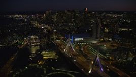 5.5K aerial stock footage flying by skyline, approaching Zakim Bridge, Downtown Boston, Massachusetts, night Aerial Stock Footage | AX141_066E