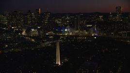 5.5K aerial stock footage orbiting Bunker Hill Monument, Zakim Bridge, and Boston skyline seen from Charlestown, Massachusetts, twilight Aerial Stock Footage | AX141_070E