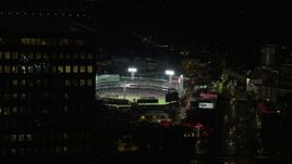 5.5K aerial stock footage flying by baseball game, Fenway Park, eclipsed by Prudential Tower, Boston, Massachusetts, night Aerial Stock Footage | AX141_079E