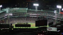 5.5K aerial stock footage flying by baseball game, Fenway Park, Boston, Massachusetts, night Aerial Stock Footage | AX141_081E
