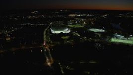 5.5K aerial stock footage approaching Harvard Stadium, tilt down, Harvard University, Massachusetts, night Aerial Stock Footage | AX141_105