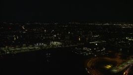 5.5K aerial stock footage flying by city lights, revealing Doubletree Suites, Allston, Massachusetts, night Aerial Stock Footage | AX141_114