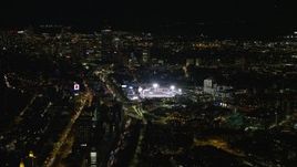 5.5K aerial stock footage flying by baseball game at Fenway Park, Downtown Boston, Massachusetts, night Aerial Stock Footage | AX141_127E