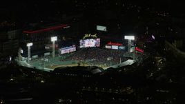 5.5K aerial stock footage flying closely by baseball game at Fenway Park, Boston, Massachusetts, night Aerial Stock Footage | AX141_132