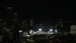 5.5K aerial stock footage flying by Fenway Park with a baseball game in progress, Boston, Massachusetts, night Aerial Stock Footage | AX141_143