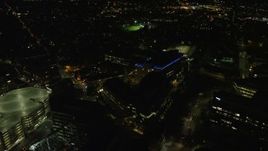 5.5K aerial stock footage flying by office buildings, sports fields, Cambridge, Massachusetts, night Aerial Stock Footage | AX141_166