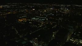 5.5K aerial stock footage flying by office buildings, city lights, Cambridge, Massachusetts, night Aerial Stock Footage | AX141_167