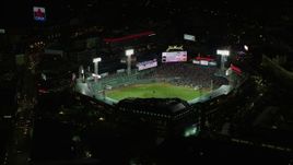 5.5K aerial stock footage flying away from baseball game, Fenway Park, Boston, Massachusetts, night Aerial Stock Footage | AX141_180