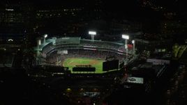 5.5K aerial stock footage orbiting a crowded baseball game, Fenway Park, Boston, Massachusetts, night Aerial Stock Footage | AX141_186E