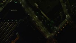 5.5K aerial stock footage of a bird's eye view over small bridge, city street, Downtown Boston, Massachusetts, night Aerial Stock Footage | AX141_209E
