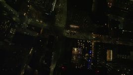 5.5K aerial stock footage of a bird's eye view over light traffic, city streets, skyscrapers, Downtown Boston, Massachusetts, night Aerial Stock Footage | AX141_212E