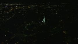 5.5K aerial stock footage orbiting Dorchester Heights Monument, reveal skyline, South Boston, Downtown Boston, Massachusetts, night Aerial Stock Footage | AX141_223E