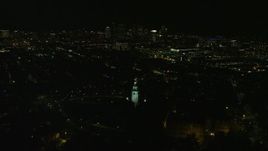 5.5K aerial stock footage of Dorchester Heights Monuments, lights of downtown skyline, South Boston, Massachusetts, night Aerial Stock Footage | AX141_229E