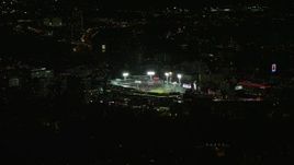 5.5K aerial stock footage flying by baseball game in progress, Fenway Park, Boston, Massachusetts, night Aerial Stock Footage | AX141_243E