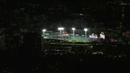 5.5K aerial stock footage orbiting away from a baseball game at night at Fenway Park, Boston, Massachusetts Aerial Stock Footage | AX141_245